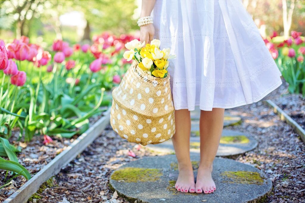 Woman with Flowers. Slow Living Life. Nature.